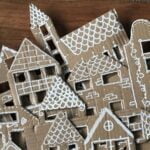 DIY kerstversiering met deze Hollandse huisjes van oud karton.