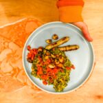 Vegan stew kale with vegan sausages.