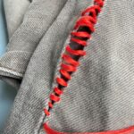 Leer om zelf je kleding te repareren.